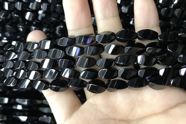 CAA2490 15.5 inches 6*12mm faceted & twisted rice black agate beads