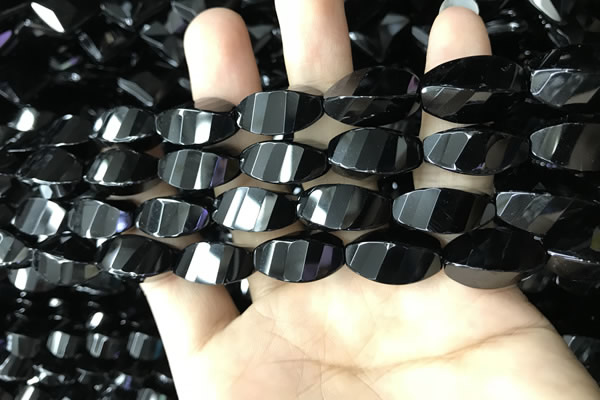CAA2492 15.5 inches 10*20mm faceted & twisted rice black agate beads