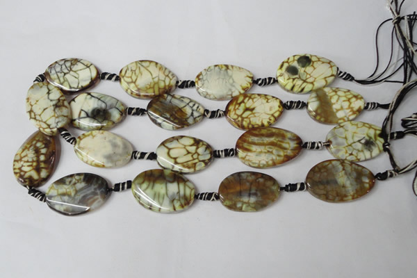 CAG1577 15.5 inches 20*30mm twisted oval fire crackle agate beads