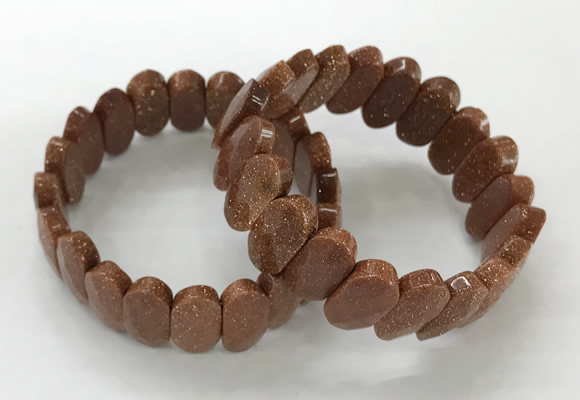 CGB3323 7.5 inches 10*20mm faceted oval goldstone bracelets