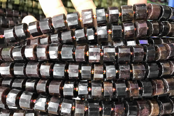CRB2097 15.5 inches 11mm - 12mm faceted tyre orange garnet beads